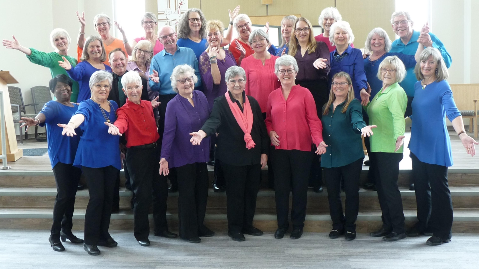 Members of Something Good performing in bright colours.